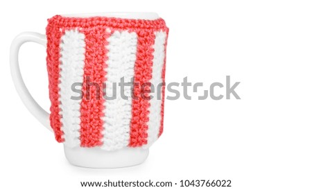 knitted tea cup isolated on white background. copy space, template.