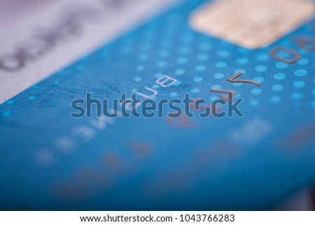 Credit card in close up. Abstract photo of bank card with shallow depth of field
