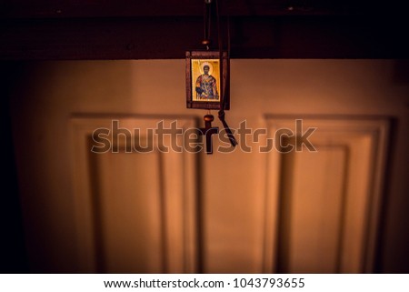Holy Bible, cross on a  table in church ready for ceremony.  Royalty-Free Stock Photo #1043793655