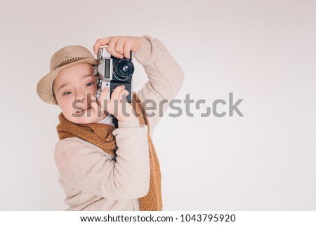 Family with fun,BOY with Down Syndrome, BOY with Down Syndrome take off PHOTO-EQUIPMENT, BABY PHOTOGRAPH, PHOTOGRAPHE WORK, SPECIAL KIDS,copy space Royalty-Free Stock Photo #1043795920