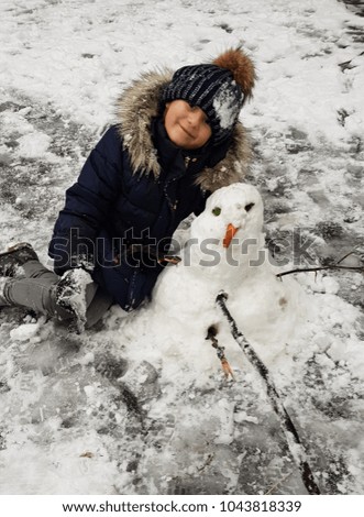 happy girl with a snow man