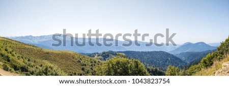 Photo of scenic mountainous area against blue sky