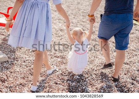 family with child relax on beach. Montenegro, Sveti Stefan.