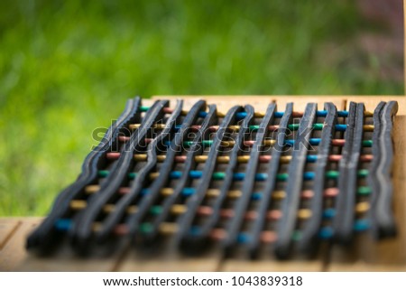 Colorful hand made of rubber foot wipes on the wooden stair, with background is blurred  