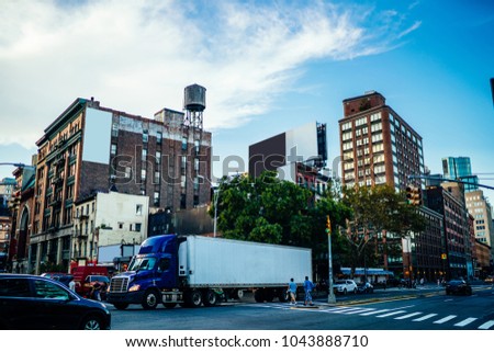 Publicity mock up area for advertising or commercial information Lightbox on exterior of modern buildings in urban setting, blank billboards on cargo van vehicle moving in city street,logistic company