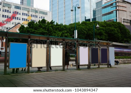 Bus station billboards with blank copy space posters for advertising text message or promotional content, empty mock up Lightbox for information, bus stop shelter clear display in urban city street