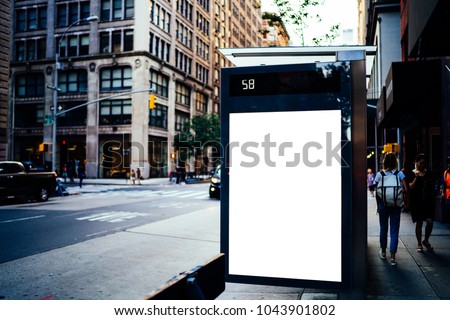 Bus station billboard with blank copy space screen for advertising text message or promotional content, empty mock up Lightbox for information, stop shelter clear poster display in urban city street
