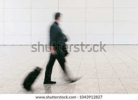 blurred anonymous businessman at a airport