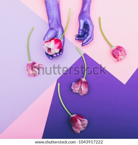pearly purple hands and tulips. ultra violet. pastel minimal. beautiful concept. flat lay
