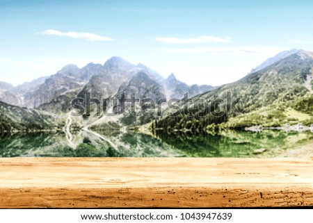 Table background of free space and landscape of lake with mountains 