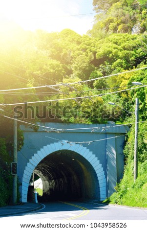 Road entering mountain tunnel in Wellington, New Zealand