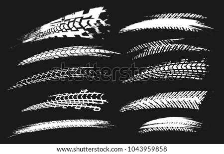 Motorcycle tire tracks vector illustration. Grunge automotive element useful for poster, print, flyer, book, booklet, brochure and leaflet design. Editable graphic set isolated on a black background.