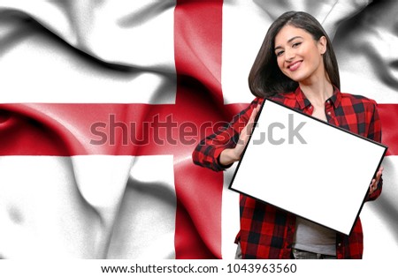 Woman holding blank board against national flag of England