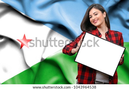 Woman holding blank board against national flag of Dijbouti