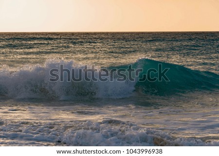 High waves of the Atlantic ocean on the beach of the Caribbean sea at sunset