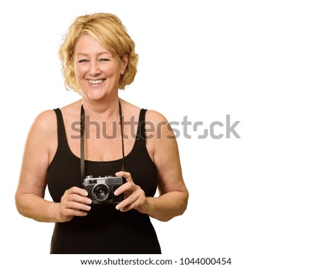 Mature Woman Holding Camera Isolated On White Background