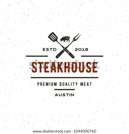 vintage steak house logo. retro styled grill restaurant emblem, badge, design element, logotype template. vector illustration Royalty-Free Stock Photo #1044000760