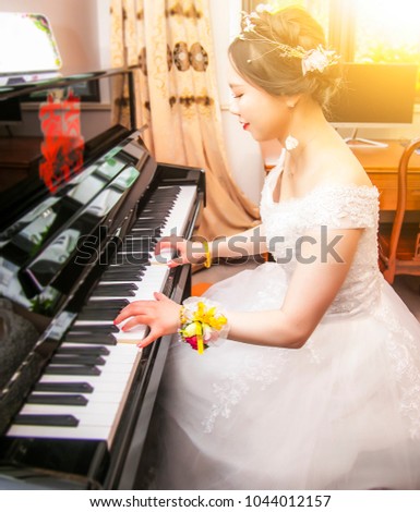 The bride playing the piano