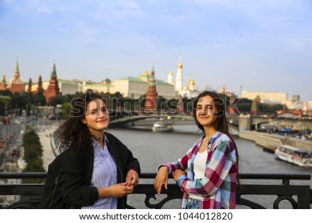 Portrait of beautiful girls on the Moscow city background