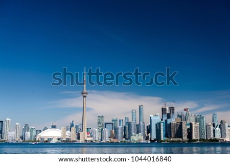 Toronto city skyline on clear sunny day.