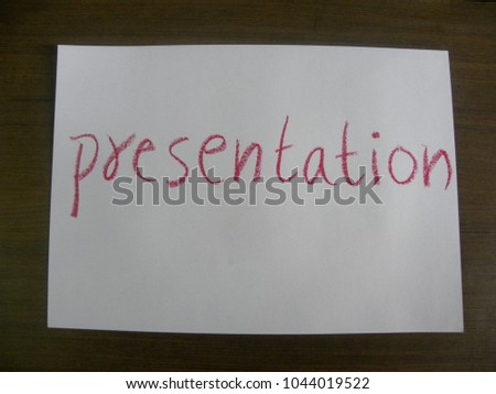 Text presentation hand written by red oil pastel on white color paper