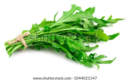 green fresh rucola leaves isolated on white background. Rocket salad or arugula. Royalty-Free Stock Photo #1044021547
