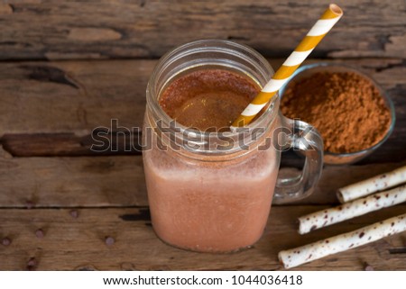 Chocolate and cocoa Smoothies on wooden background