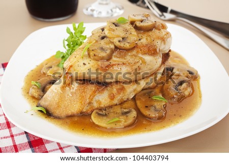 Popular Italian American dish, Marsala Chicken, served over toasted baguette. Chicken breast in a rich, sweet sauce with marsala, chicken stock and mushrooms.