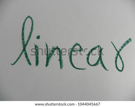 Text linear hand written by green oil pastel on white color paper
