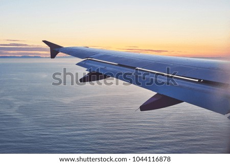 orning sunrise with Wing of an airplane. Photo applied to tourism operators. picture for add text message or frame website. Traveling concept.