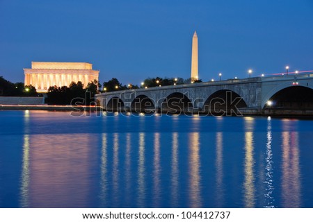 The Lincoln Memorial, Arlington Memorial Bridge and Washington Monument reflected in the Potomac River at dusk. Washington, DC