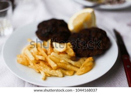 baked burgers with fried potatoes GREEK FOOD