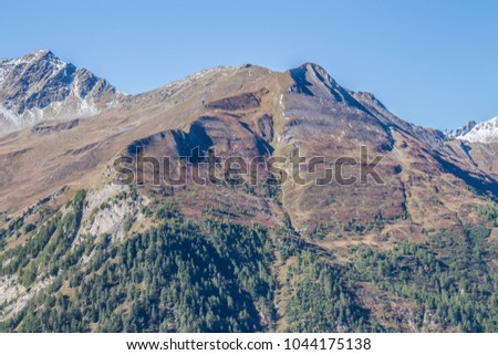 
Panorama view  of High Alpines mountains. Beautiful Tirol nature with blue sky. Nice picture as background or big poster.
