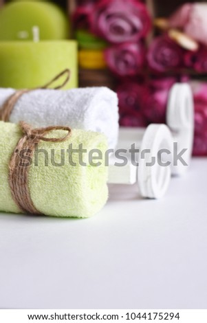 Spa concept towels massage buds flowers rose and fragrance candles