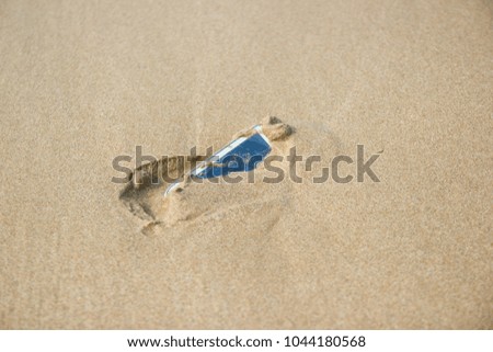 Mobile phone floated to the sea at the beach.