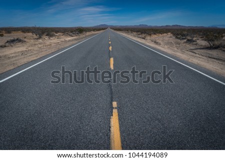 Middle of desert road vanishing point