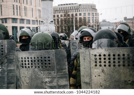 Special police unit with shields against protesters. Belarusian people participate in the protest against Lukashenko and the current authorities. Minsk, Belarus Royalty-Free Stock Photo #1044224182