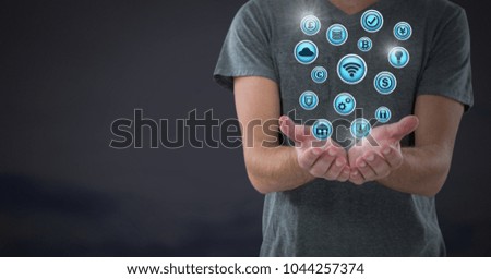 Digital composite of hands palm open with various business icons