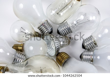 A pile of old light sources / lamps ready to be recycled. Royalty-Free Stock Photo #1044262504