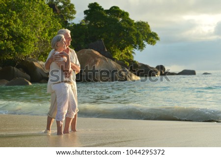 elderly couple  in tropical garden