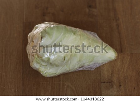 chinese coleslaw in plastic on wooden background