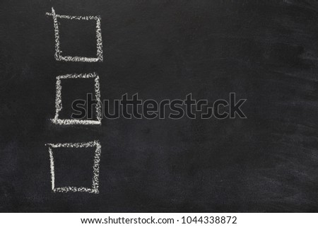 Three empty checkboxes on blackboard. Checklist template drawn with chalk. Choice, analisys, vote conceptual background, copy space, top view