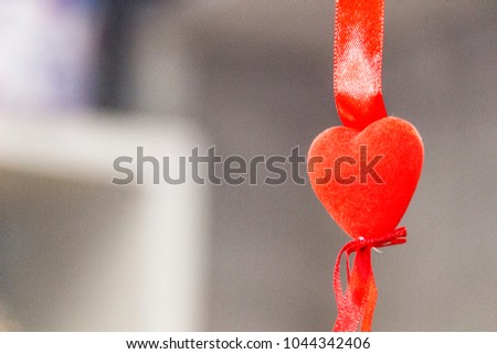 Red heart on a suspension bracket
