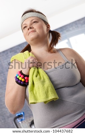 Portrait of overweight female in sportswear.
