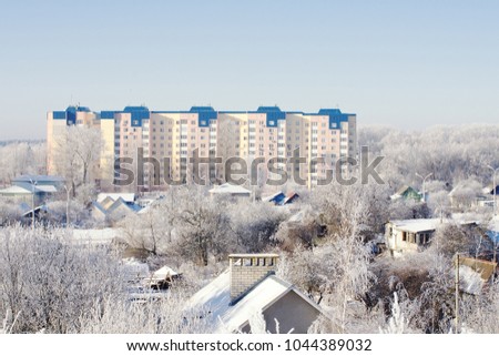 View of the city on a Sunny winter day. Big and small houses.