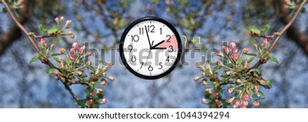 Daylight Saving Time. DST. Wall Clock going to winter time. Turn time forward. Abstract photo of changing time at spring. Royalty-Free Stock Photo #1044394294