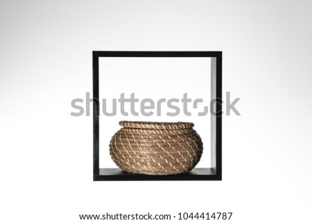 black square with a braided basket basket in it isolated on white background, isolated shape texture