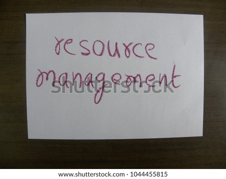 Text resource management hand written by red oil pastel on white color paper