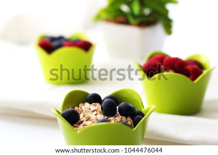 Dietary food. Oatmeal with fresh berries. Can be used as a background or ad decoration wich copy space. 