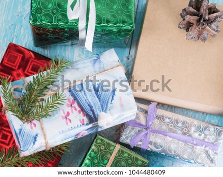 Gift packaged boxes on a blue wooden background